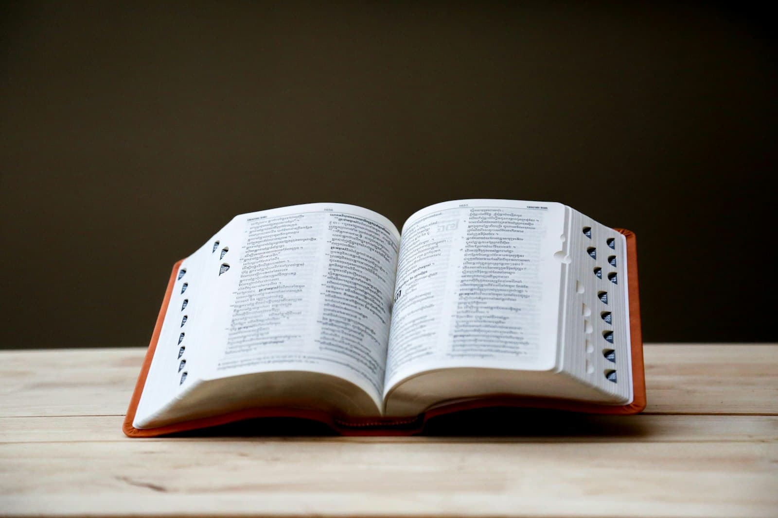 Open Bible on a brown table
